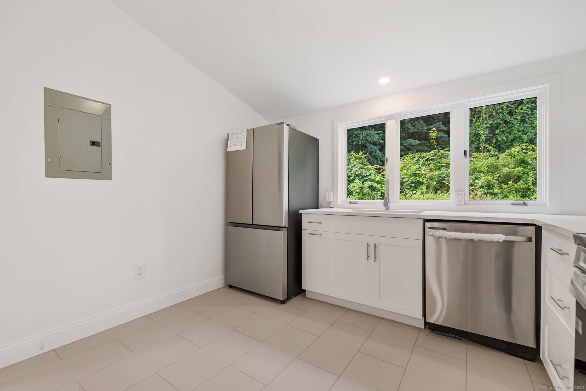 529 Danbury Road, Unit A Wilton, CT 06897 - Photo 14 of 23 a kitchen with windows and refrigerator
