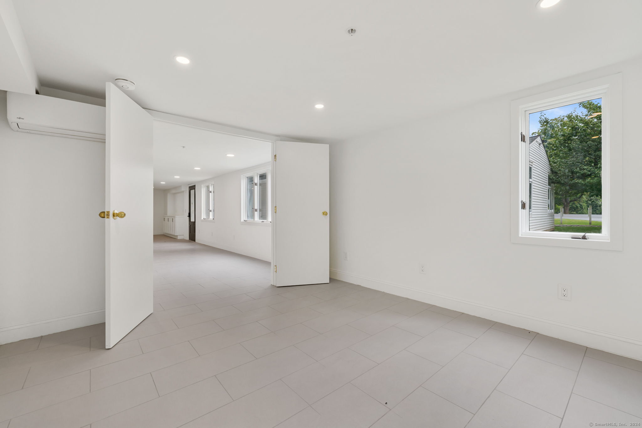 529 Danbury Road, Unit A Wilton, CT 06897 - Photo 16 of 23 a view of a big room with windows and entryway
