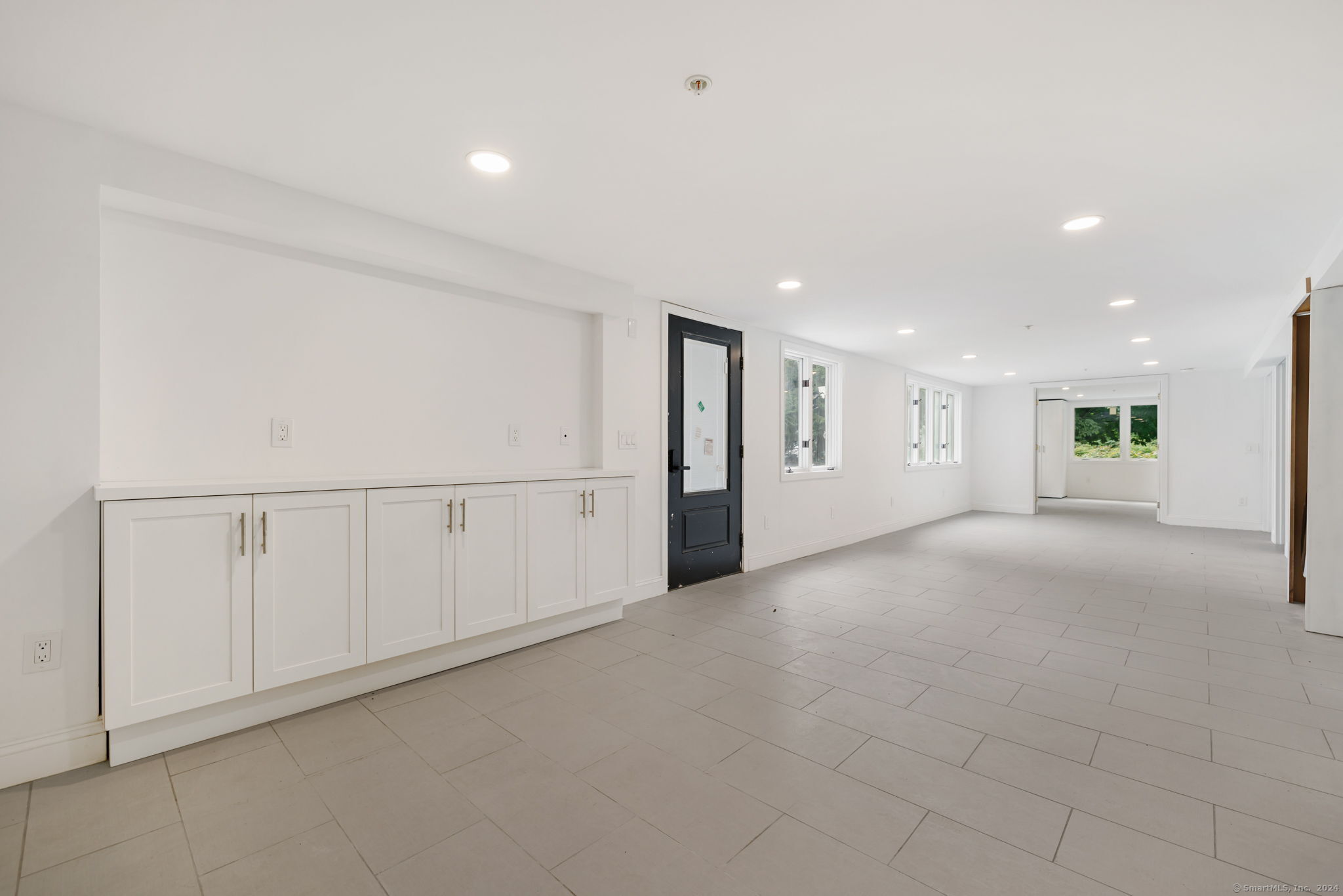 529 Danbury Road, Unit A Wilton, CT 06897 - Photo 2 of 23 a view of an empty room with a window