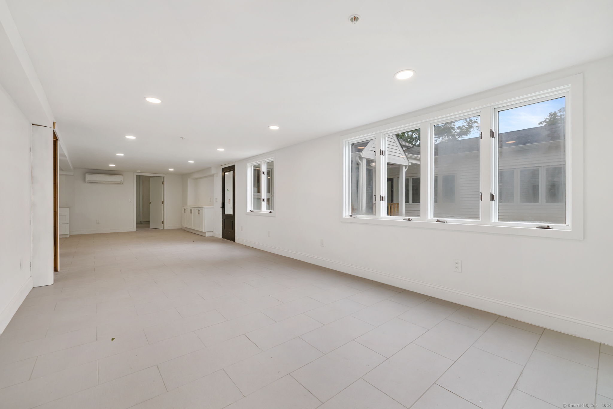 529 Danbury Road, Unit A Wilton, CT 06897 - Photo 4 of 23 a view of an empty room with a window