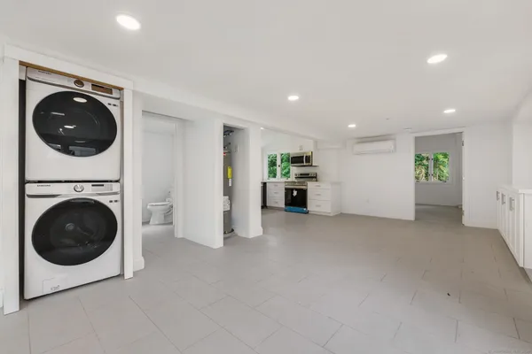 a view of a hallway with washer and dryer