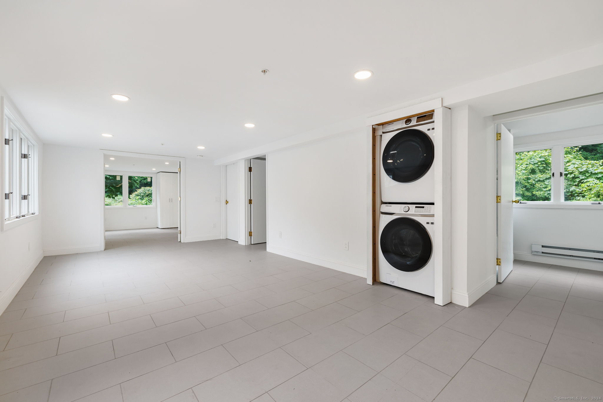529 Danbury Road, Unit A Wilton, CT 06897 - Photo 7 of 23 a view of a kitchen with a washer and dryer