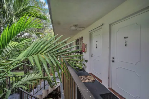a balcony with a plant in it