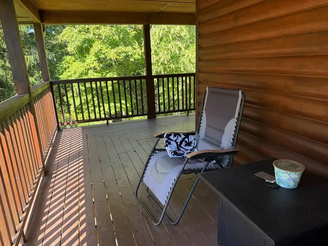 a view of a balcony with chairs