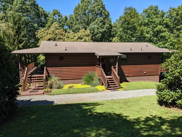 a kitchen with stainless steel appliances a refrigerator sink and microwave
