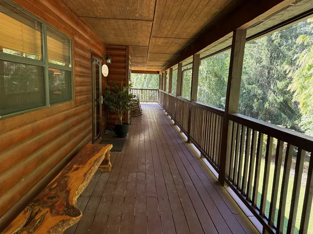 a view of a balcony with wooden floor