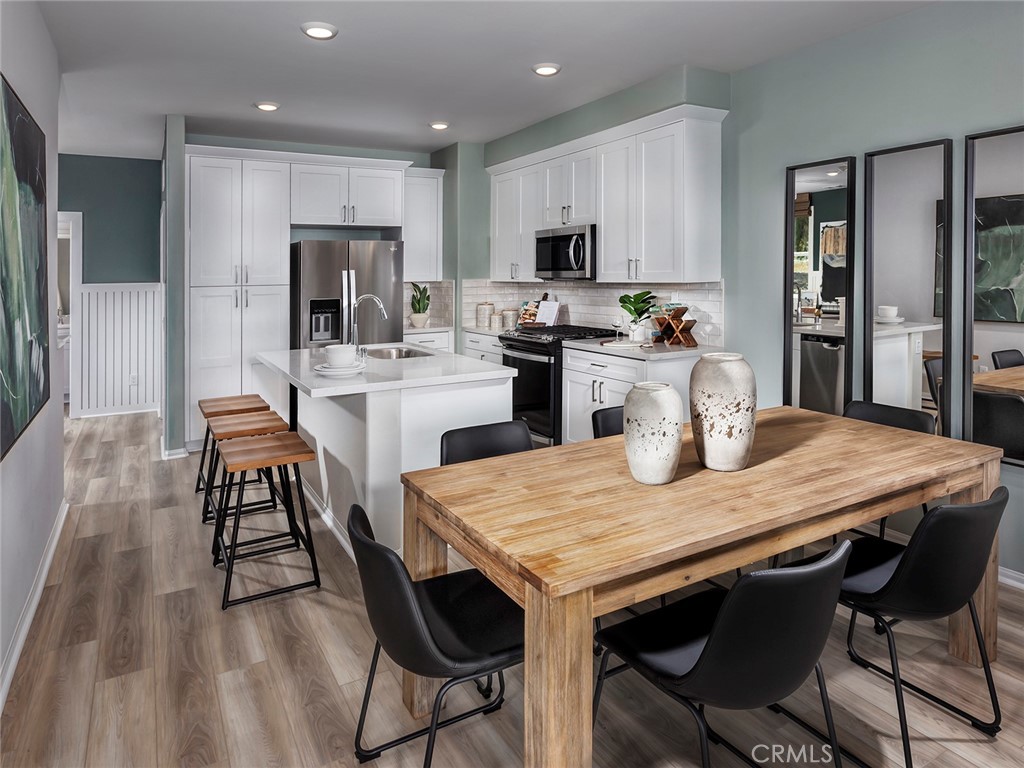 4869 Merida Way Oceanside, CA 92057 - Photo 4 of 13 Photo is not of the actual home, but is an inspirational photo of builder’s model home and may depict options, furnishings, and/or decorator features that are not included
