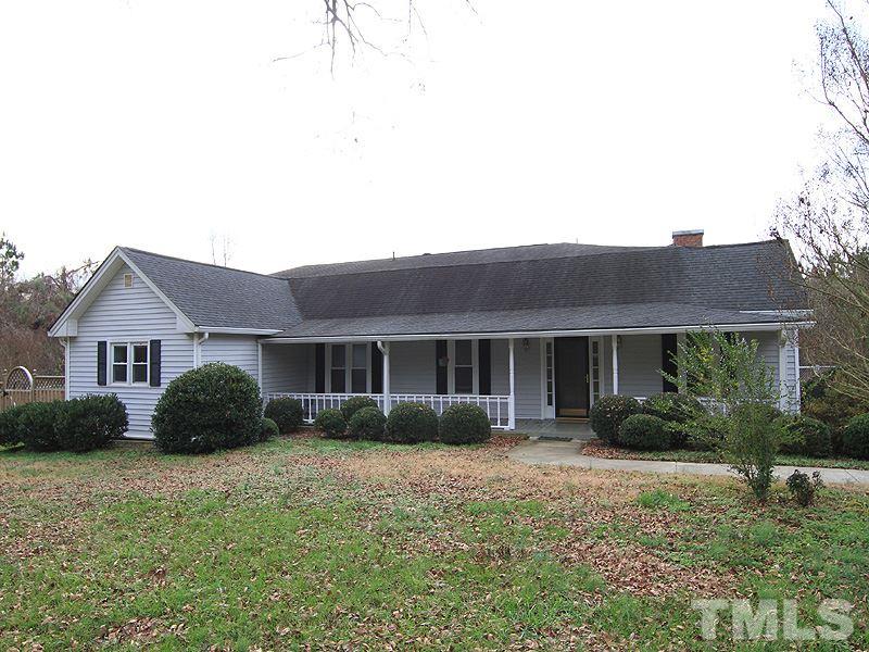 2216 Ellis Chapel Road Bahama, NC 27503 - Photo 1 of 13 a front view of a house with garden