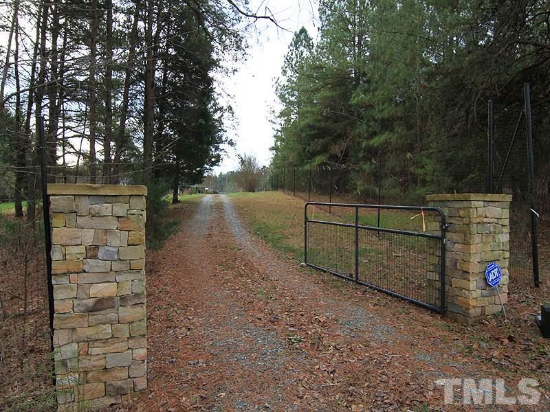 2216 Ellis Chapel Road Bahama, NC 27503 - Photo 2 of 13 a view of a pathway with a wrought fence