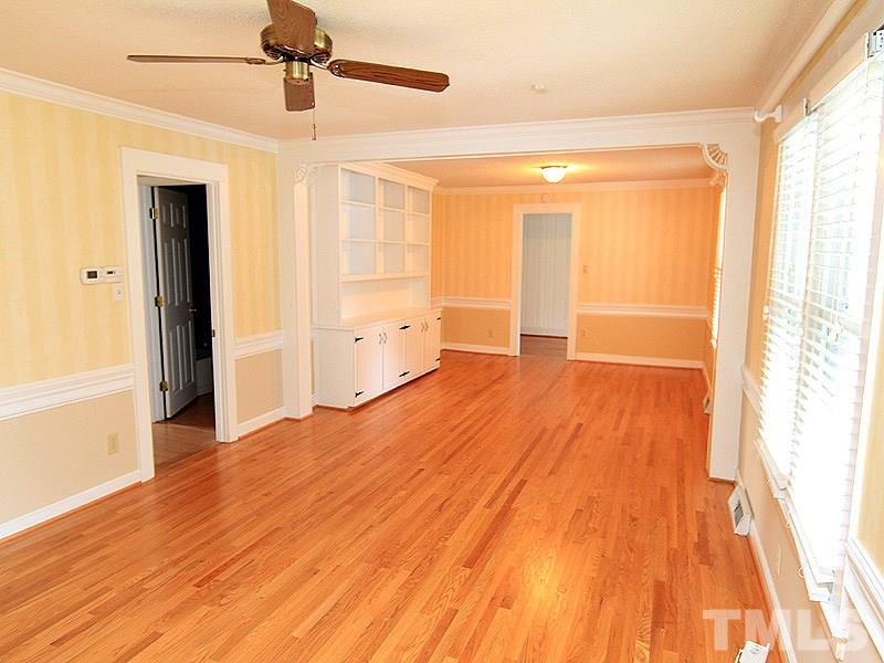 2216 Ellis Chapel Road Bahama, NC 27503 - Photo 5 of 13 a view of an empty room with wooden floor and a window