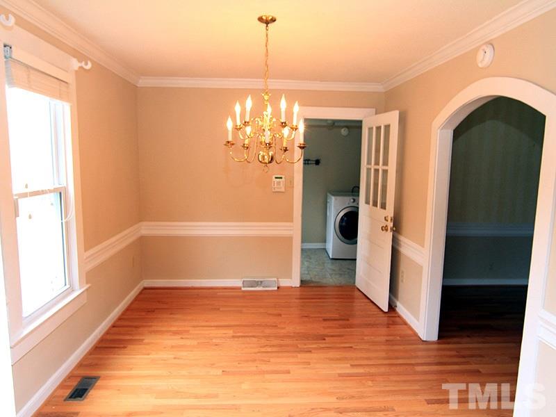 2216 Ellis Chapel Road Bahama, NC 27503 - Photo 6 of 13 a view of empty room with wooden floor and fan