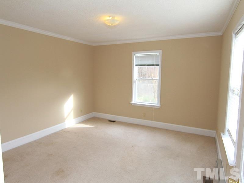 2216 Ellis Chapel Road Bahama, NC 27503 - Photo 10 of 13 an empty room with a window