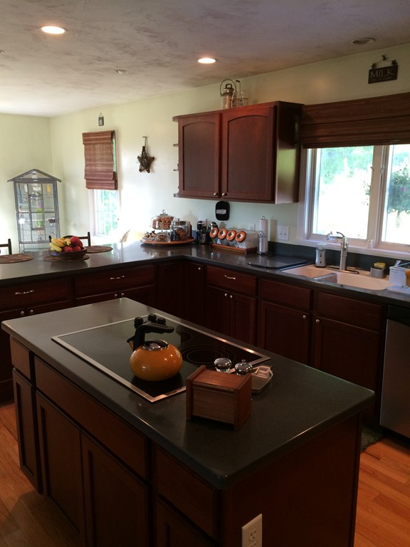 246 East County Road Rutland, MA 01543 - Photo 8 of 30 a kitchen with a sink a stove and refrigerator