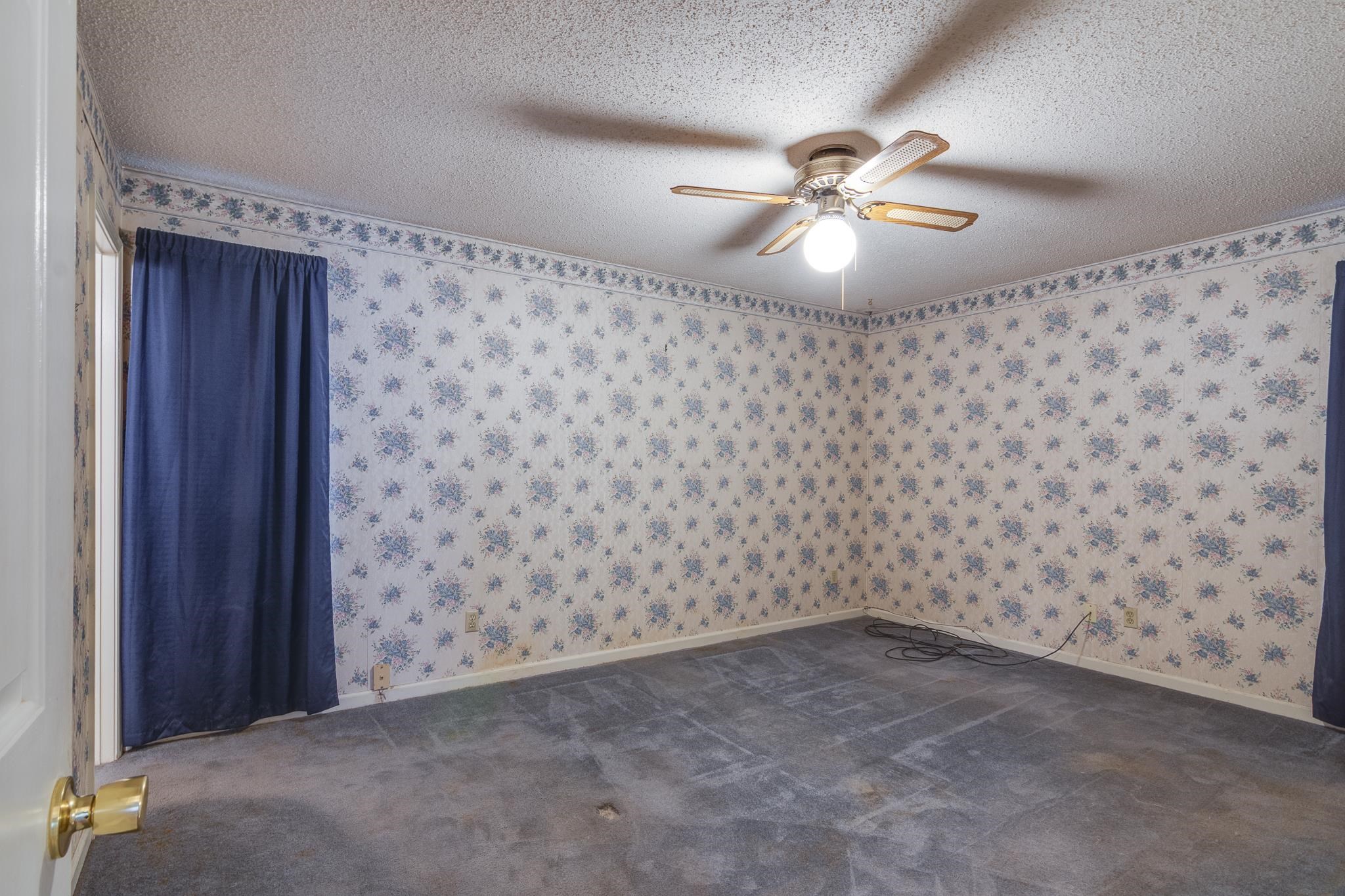 8083 Cinders Road Bartlett, TN 38133 - Photo 16 of 31 Bedroom featuring textured ceiling, ceiling fan with light fixture, carpeted flooring, and floral wallpaper