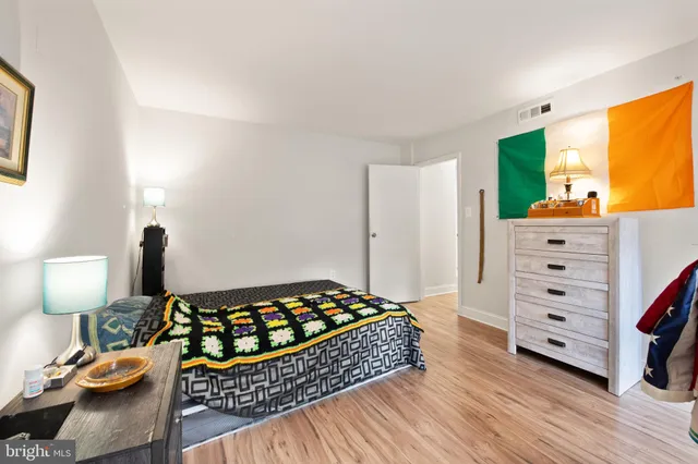 a bedroom with a bed and a dresser