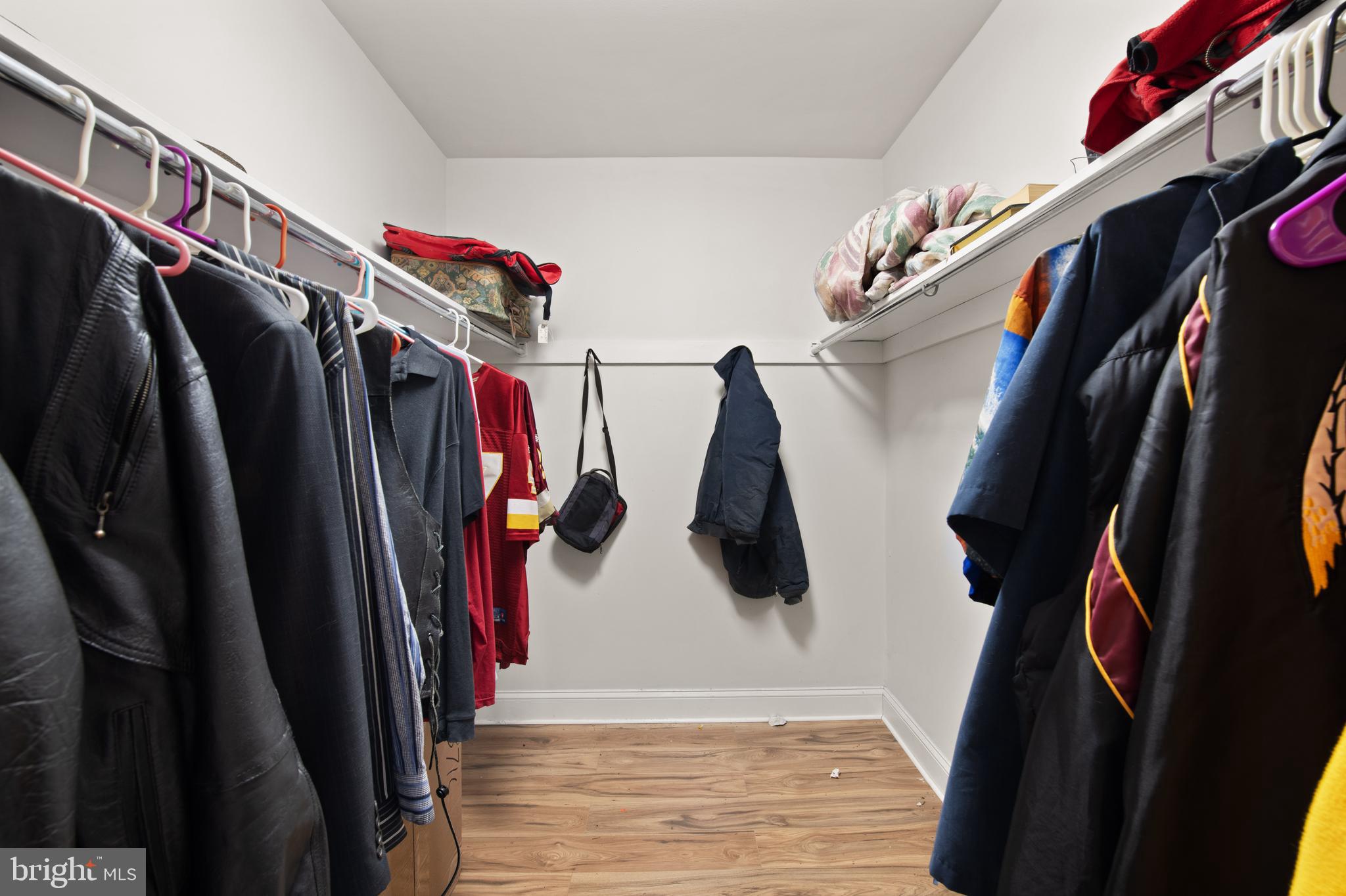3914 Bel Pre Road, Unit 3914 Silver Spring, MD 20906 - Photo 13 of 16 a view of walk in closet with clothes and shoes