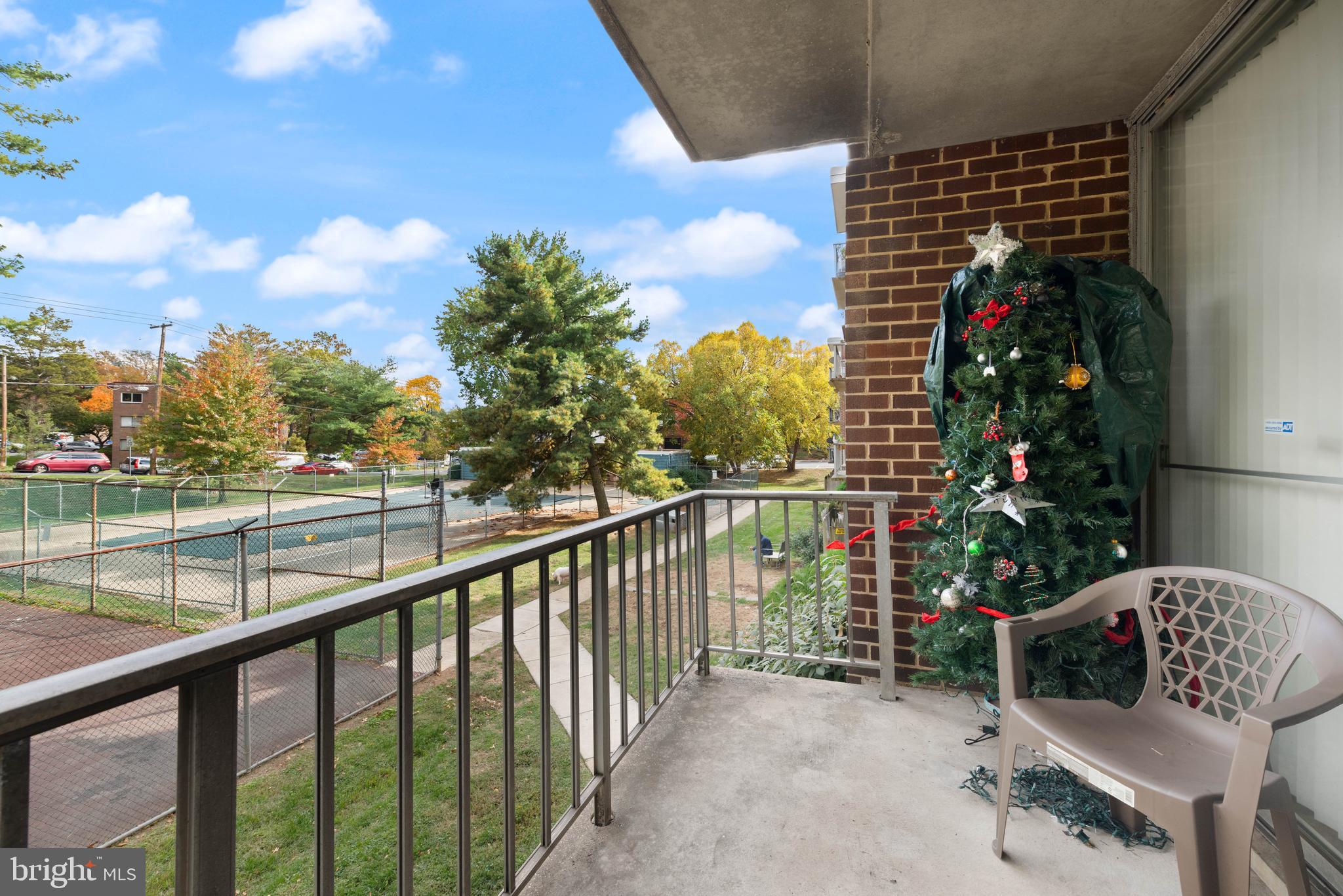 3914 Bel Pre Road, Unit 3914 Silver Spring, MD 20906 - Photo 15 of 16 a view of balcony with wooden floor and outdoor seating