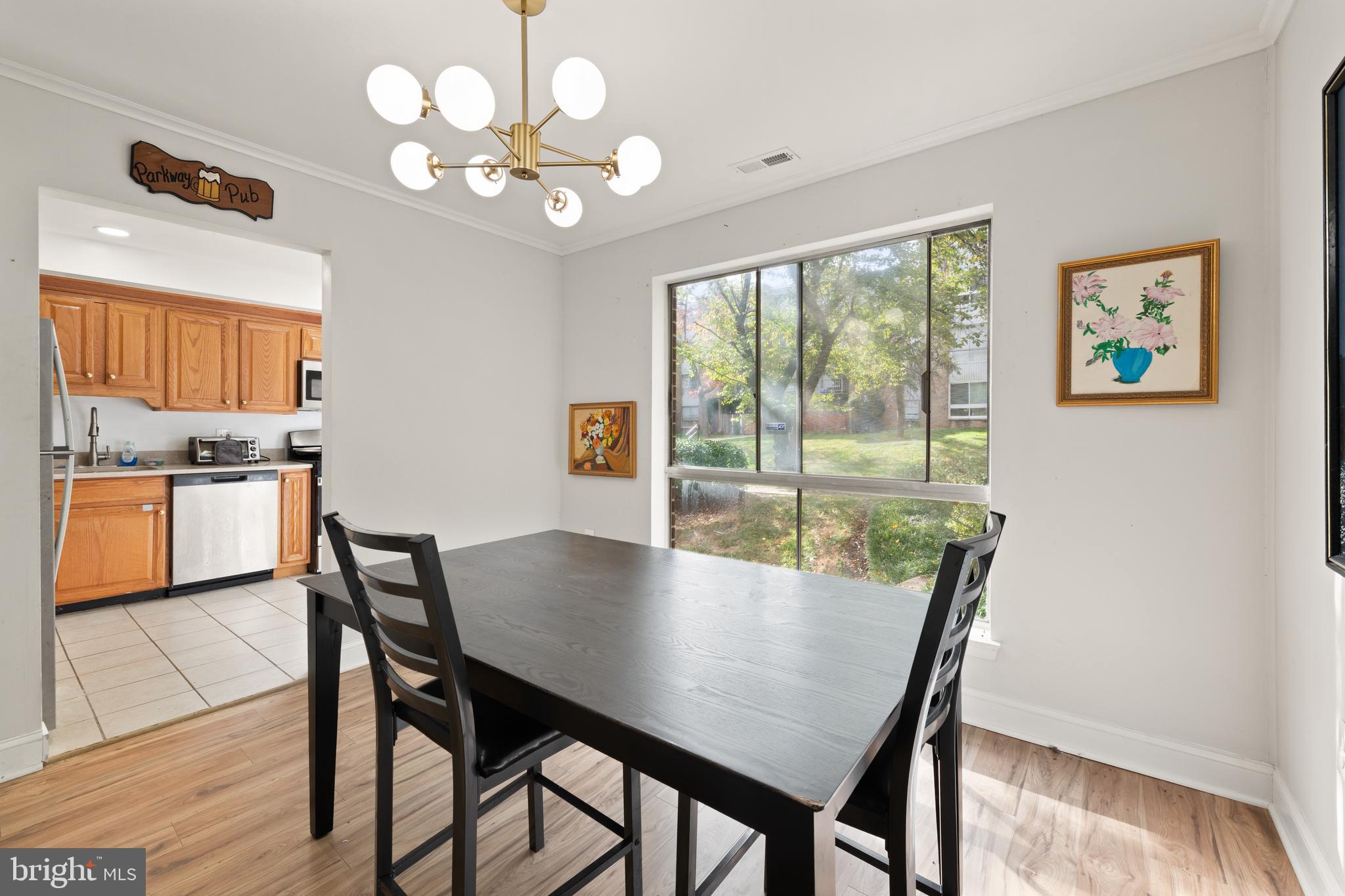 3914 Bel Pre Road, Unit 3914 Silver Spring, MD 20906 - Photo 5 of 16 a view of a dining room with furniture window and outside view