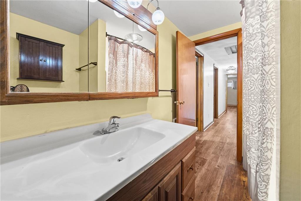 176 McMichael Road Pittsburgh, PA 15205 - Photo 13 of 32 a bathroom with a sink and a mirror