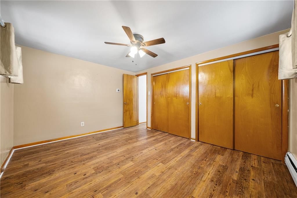 176 McMichael Road Pittsburgh, PA 15205 - Photo 19 of 32 a view of an empty room with wooden floor and a ceiling fan