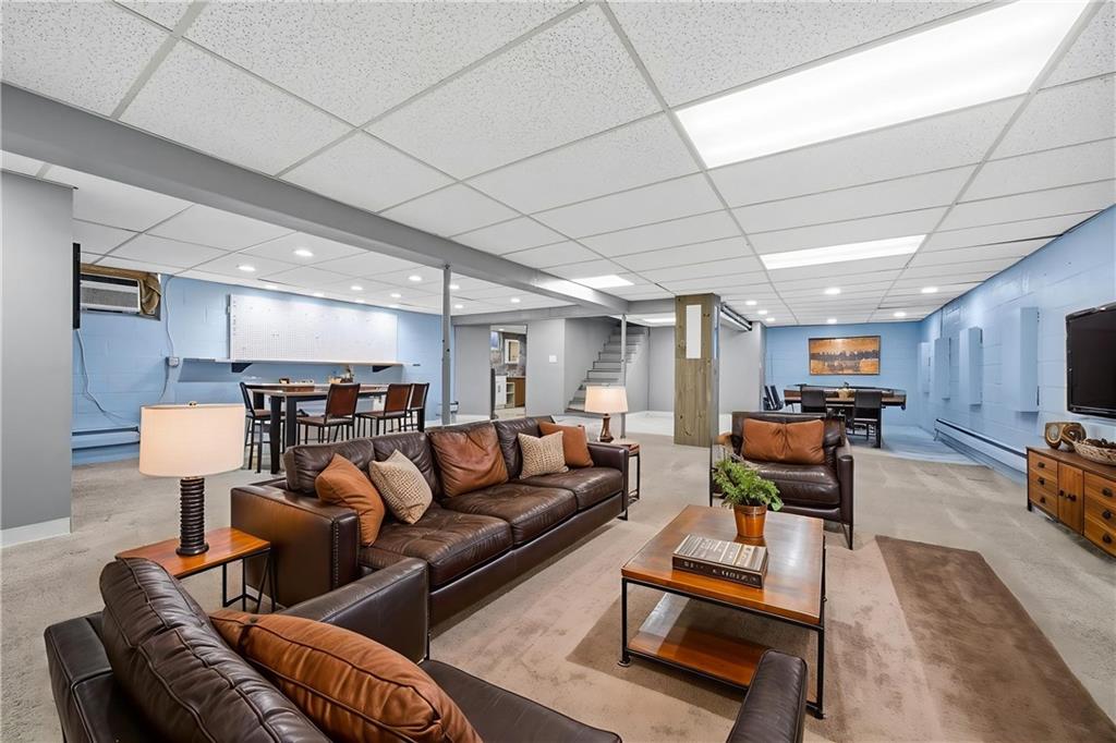 176 McMichael Road Pittsburgh, PA 15205 - Photo 20 of 32 a living room with furniture and a chandelier