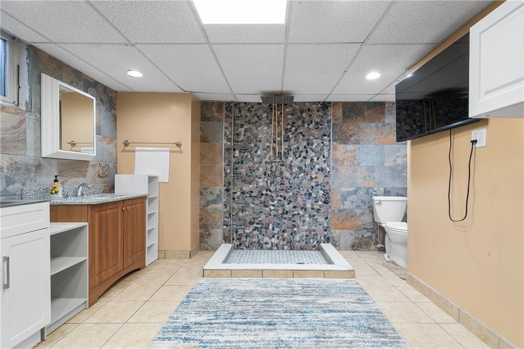 176 McMichael Road Pittsburgh, PA 15205 - Photo 26 of 32 a bathroom with a double vanity sink a toilet and shower