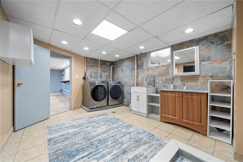 176 McMichael Road Pittsburgh, PA 15205 - Photo 27 of 32 a view of a kitchen with a sink and a stove top oven