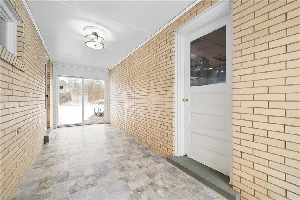 176 McMichael Road Pittsburgh, PA 15205 - Photo 5 of 32 a view of a porch with a door and wooden floor