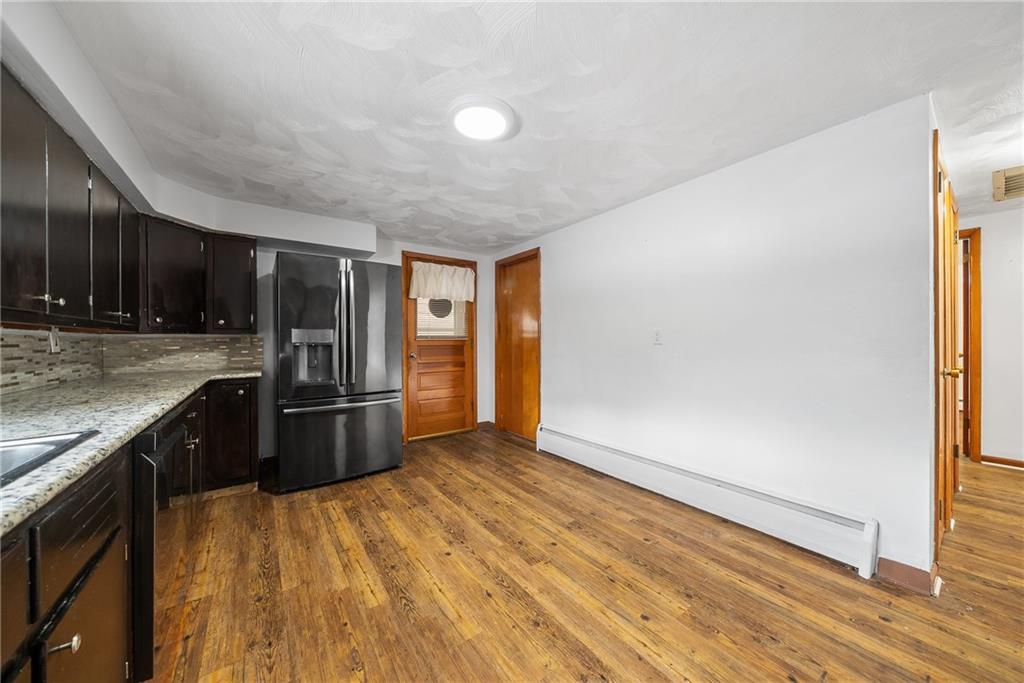 176 McMichael Road Pittsburgh, PA 15205 - Photo 7 of 32 a kitchen with stainless steel appliances granite countertop a refrigerator and a sink