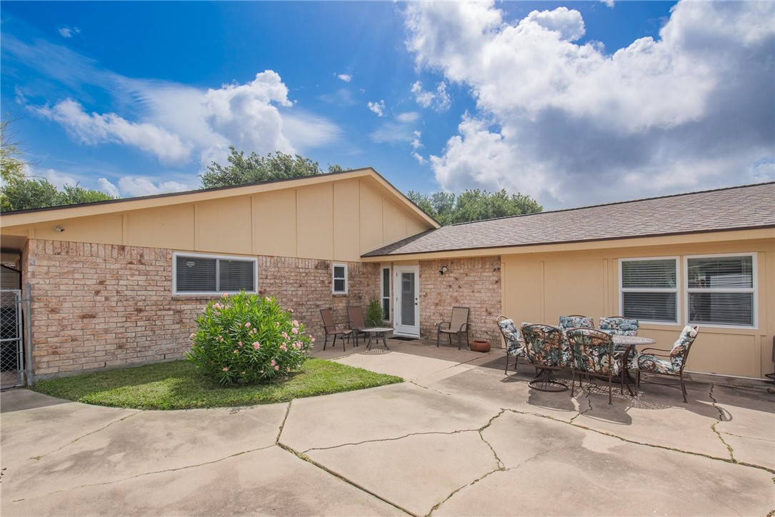 4957 Shadowbend Drive Corpus Christi, TX 78413 - Photo 12 of 35 a backyard of a house with table and chairs