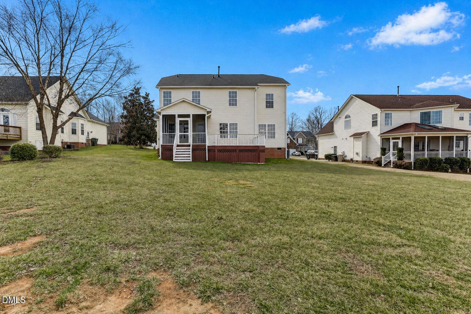 480 Seastone Street Raleigh, NC 27603 - Photo 25 of 26 a view of a house with a big yard and large trees