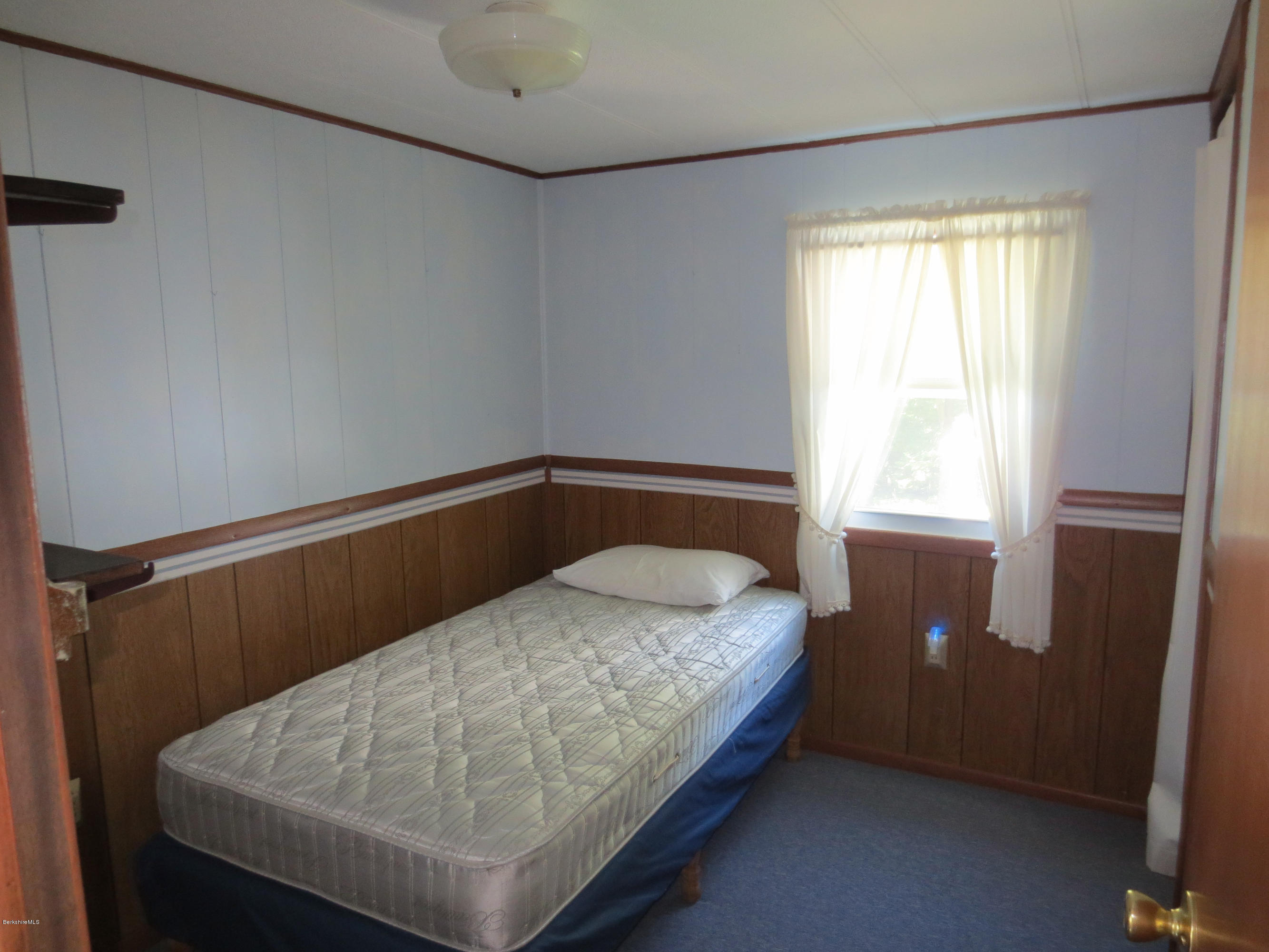 117 Bromley Road Chester, MA 01050 - Photo 14 of 17 a bedroom with a bed and window