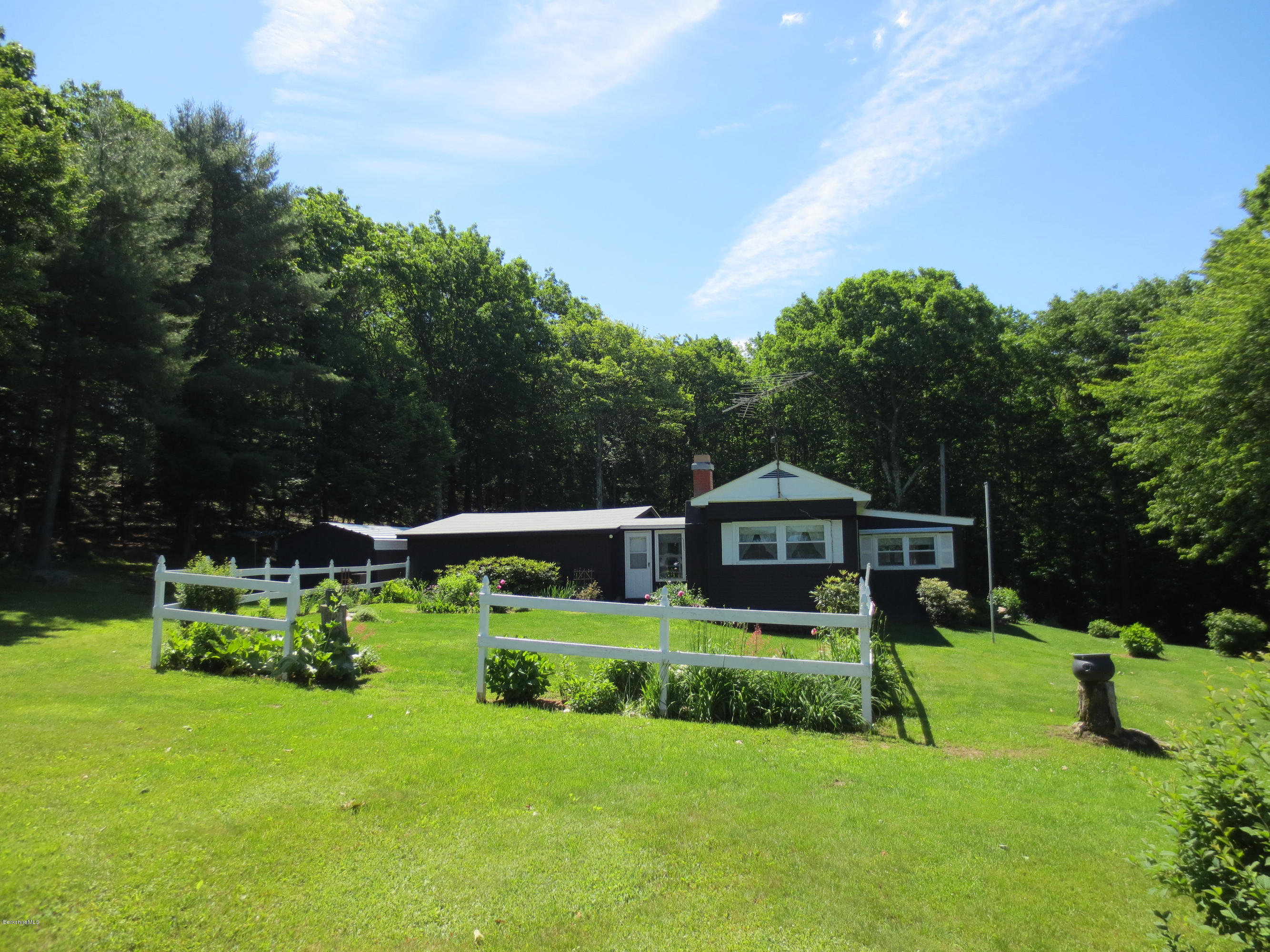 117 Bromley Road Chester, MA 01050 - Photo 3 of 17 a front view of a house with garden and trees