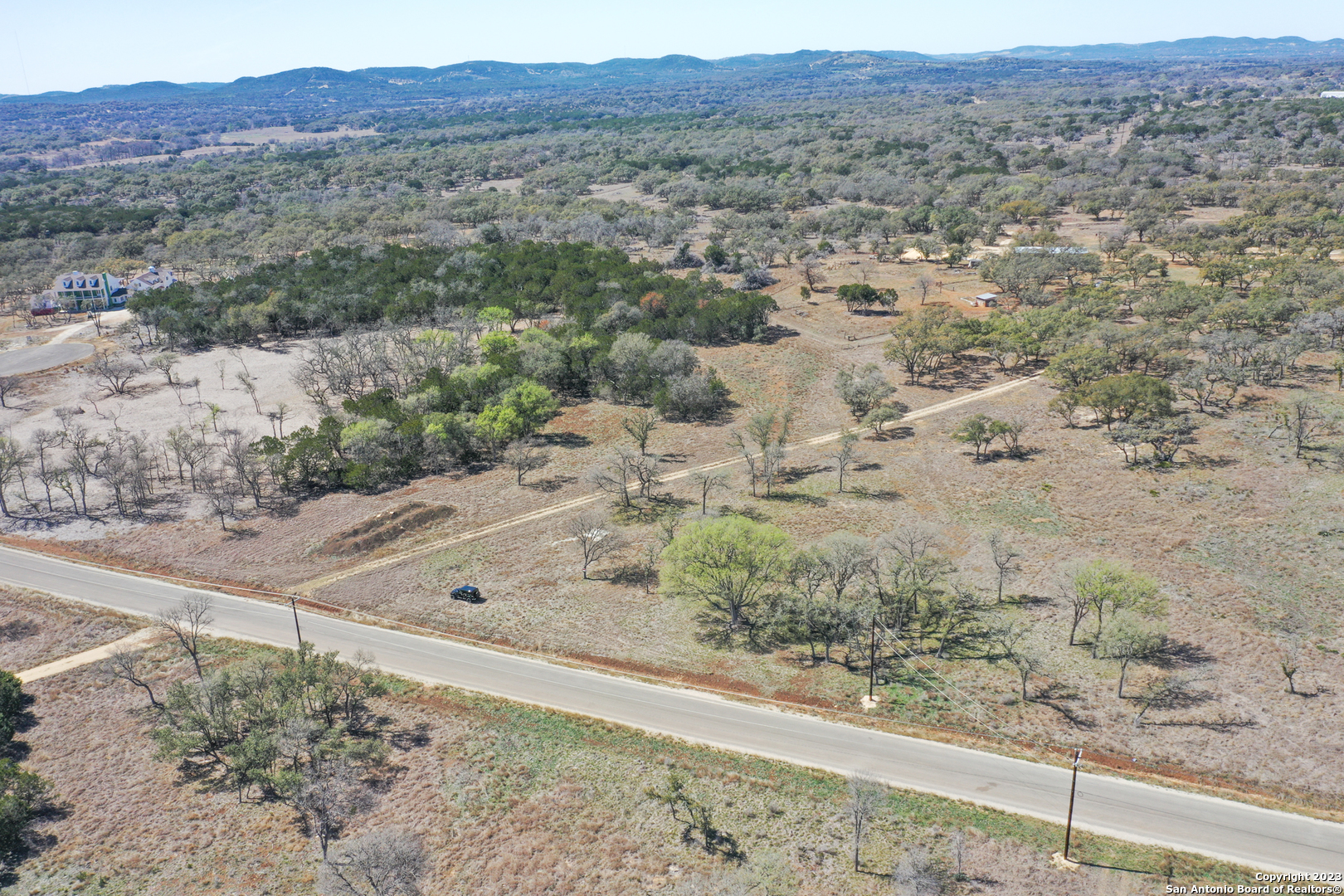 Tbd Clearwater Canyon Ranch Bandera, TX 78003 - Photo 4 of 12 a view of a dry field with trees in the background