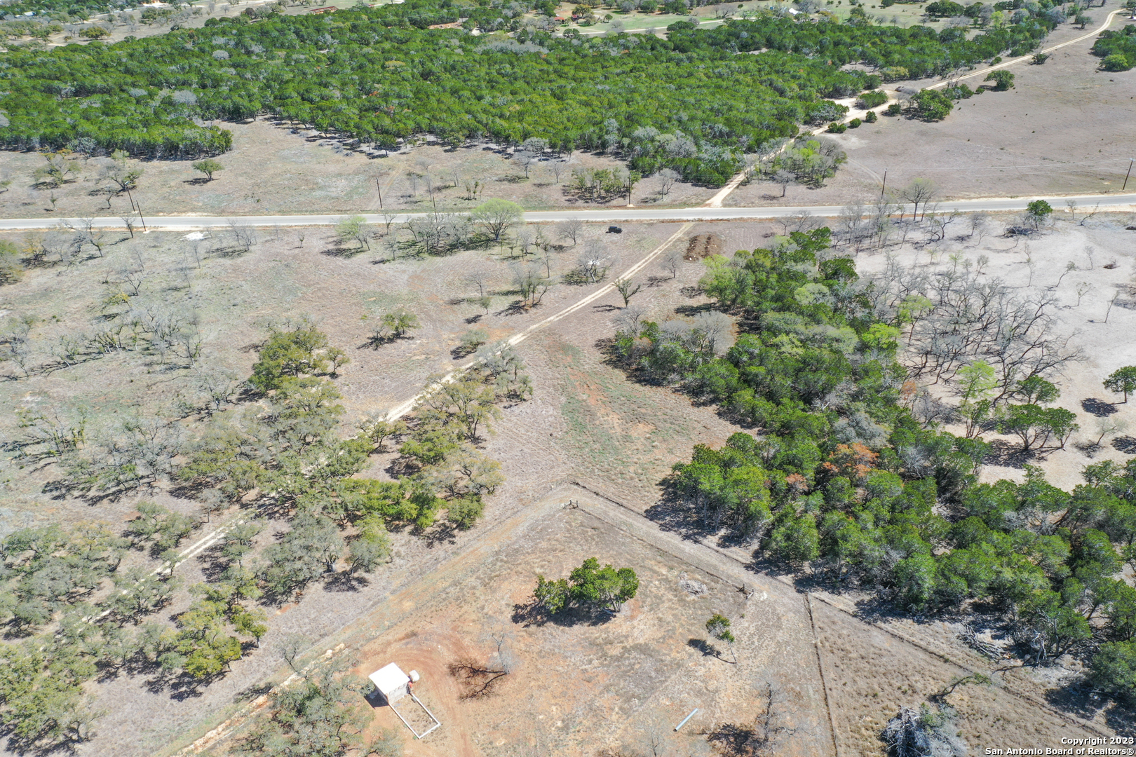 Tbd Clearwater Canyon Ranch Bandera, TX 78003 - Photo 8 of 12 an aerial view of a house with a yard