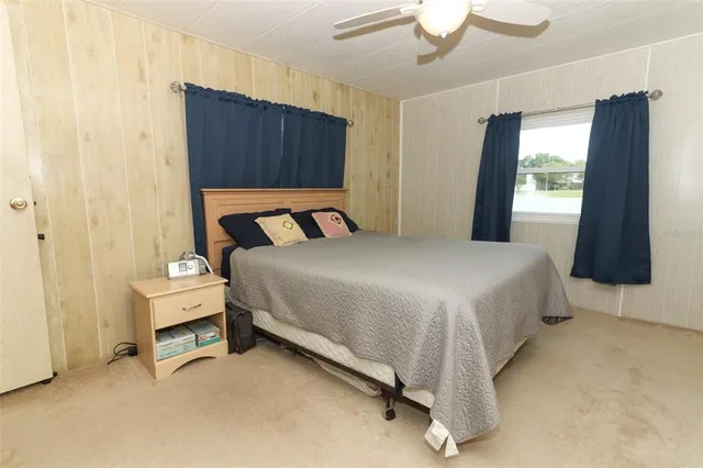 a bed room with a bed and a window