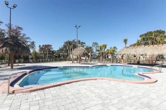 a view of a swimming pool and a chair