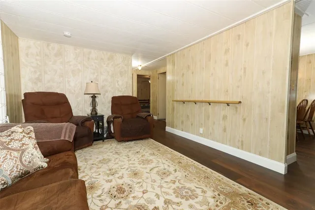 a bedroom with furniture and a rug