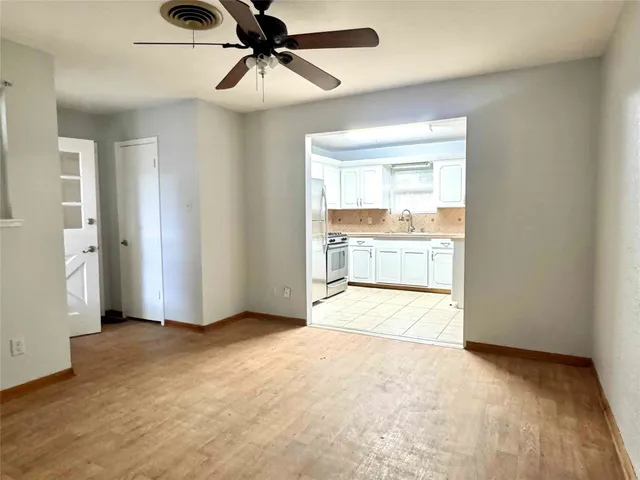 a view of an empty room and window