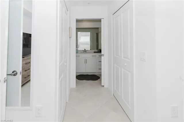 a bathroom with a bathtub shower sink and mirror