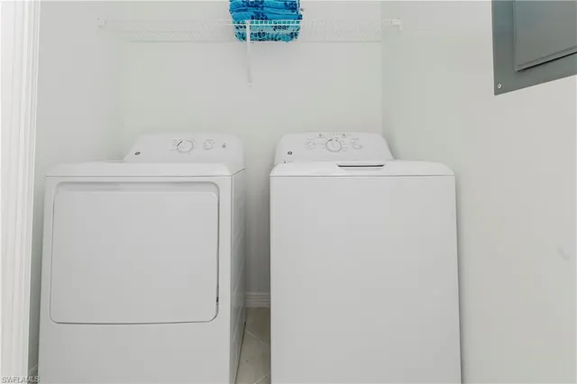 a living room with large windows and wooden floor