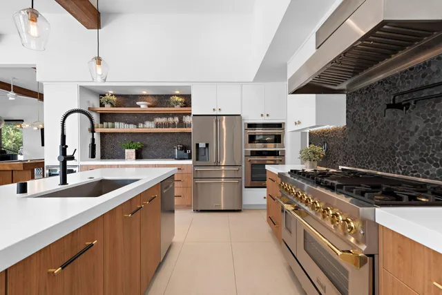 a kitchen with a stove sink and refrigerator