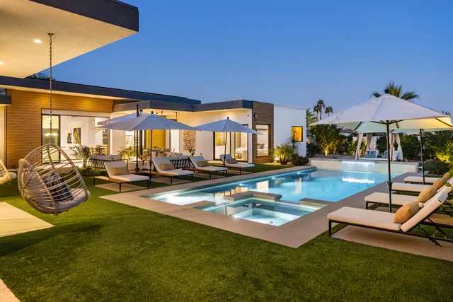 a view of a swimming pool with a patio