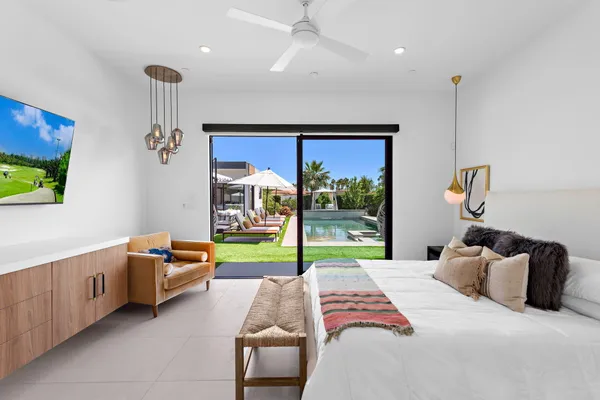 a bedroom with bed and window