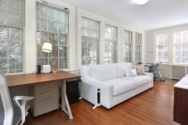 a living room with furniture and windows