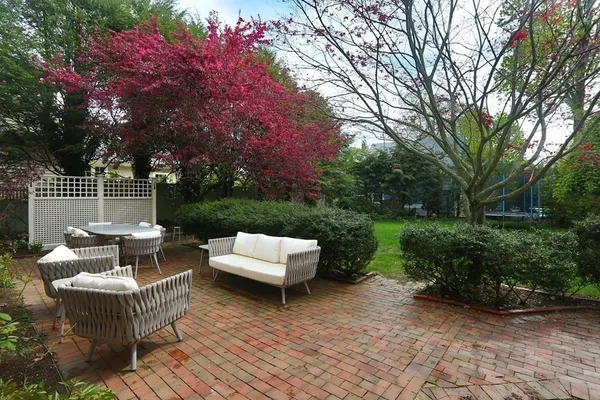 a view of a patio with couches and a fire pit