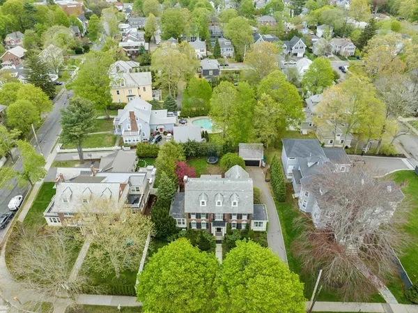 an aerial view of a house with a yard