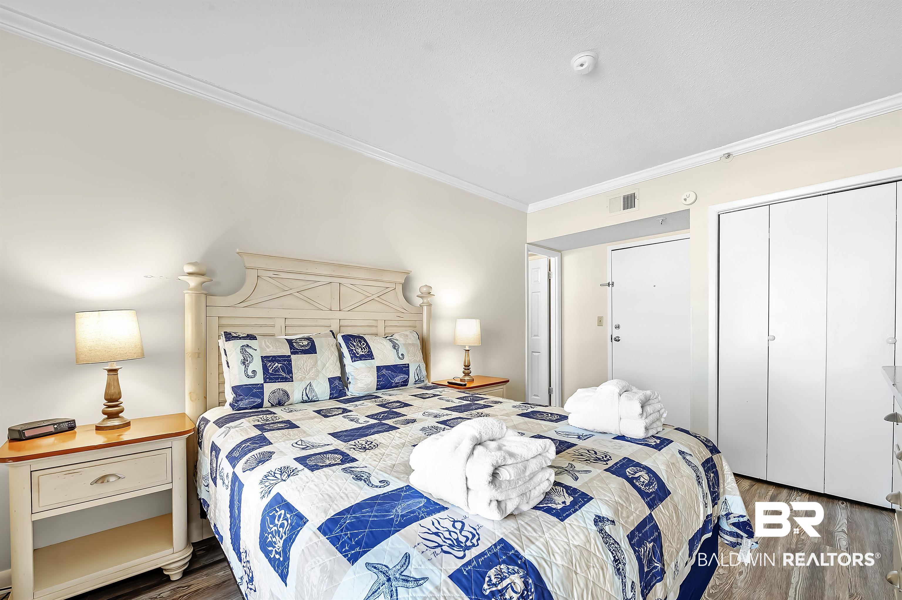 375 Plantation Road, Unit 5409 Gulf Shores, AL 36542 - Photo 18 of 48 Bedroom featuring crown molding and hardwood / wood-style floors