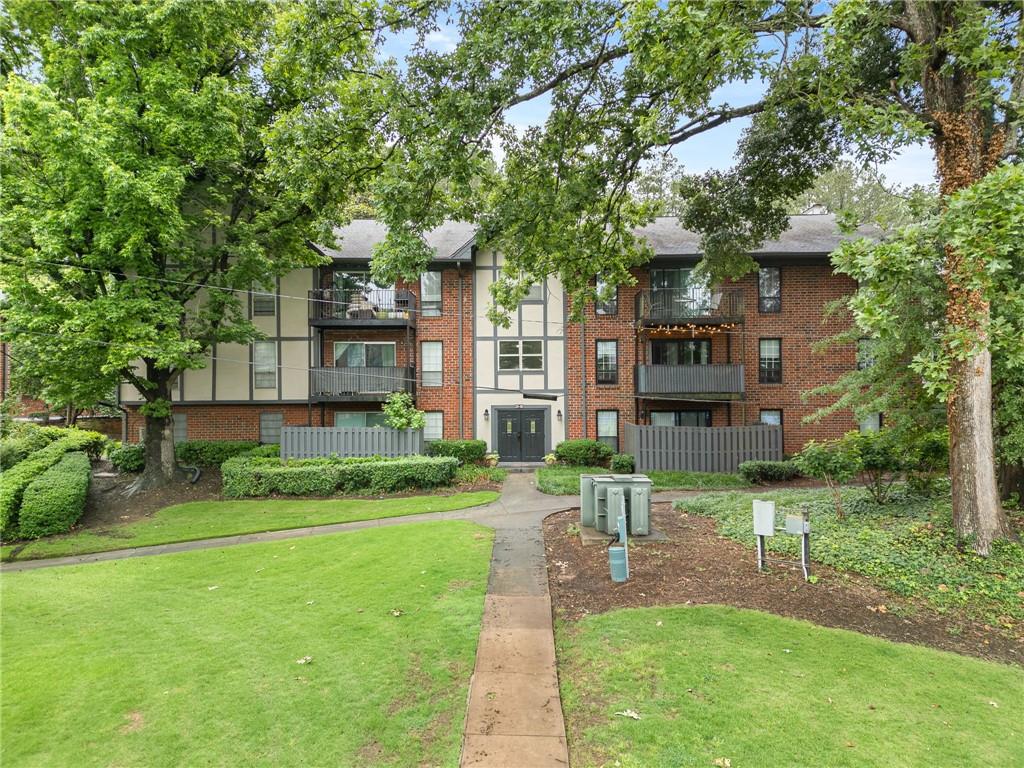 6851 Roswell Road, Unit H26 Atlanta, GA 30328 - Photo 43 of 49 a view of a house with a big yard plants and large trees
