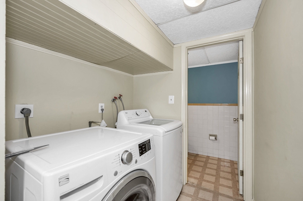 43 Constitution Way, Unit 43 Methuen, MA 01844 - Photo 11 of 25 a utility room with dryer and washer
